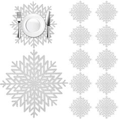 a table setting with silverware and snowflakes