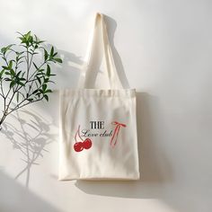 This 100% cotton bag comes in one size - 15" x 16"- perfect for everyday wear. While the canvas material will show off your designs in great colors, it's durable and will last for years. The bag features 20" handles (made from the same canvas), making it easy to carry even with a week's worth of shopping. .: 100% cotton canvas .: Heavy fabric (12 oz/yd² (406.9 g/m .: Sewn-in label .: Available in natural and black colors Cute Cotton Shoulder Bag With Letter Print, Tote Bag Aesthetic, Love Club, Canvas Making, Bag Aesthetic, The Love Club, Bags Aesthetic, Cute Tote Bags, Bag Cute