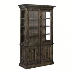 an old wooden cabinet with glass doors and shelves on the front, in grey tones