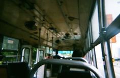 the inside of a bus with lots of windows