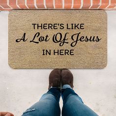 there's like a lot of jesus in here door mat on the ground with feet up