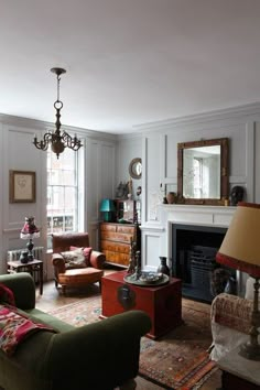 a living room filled with furniture and a fire place