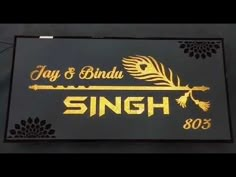 the sign for jay and binda's restaurant in singapore, which has been painted gold