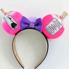 a minnie mouse ears headband with a name tag on it