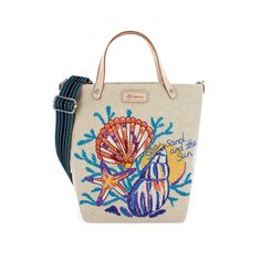 Whatever you can find or see on the beach has been artfully recreated by our designer Catherine Hong – embroidered seashells, starfish, coral, and sun make it a day at the beach everywhere you carry this bag. Hand drawn, hand painted artwork is turned into 29,000 stitches of embroidery on soft, durable canvas and leather handles, custom adjustable webbing straps, a custom designed lining and outer zip pocket make it your practical go-to. Embroidered Travel Bags For Beach Season, Embroidered Tote Bag For Beach Season, Embroidered Bucket Bag For Beach, Embroidered Beach Bag For Travel, Beach Season Embroidered Tote Bag, Sea Sand, Painted Artwork, Hobo Handbags, Hand Painted Artwork