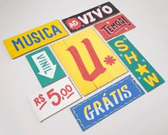 various stickers are arranged in the shape of letters and numbers on a white surface