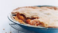 a pie sitting on top of a metal rack