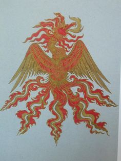 a red and gold bird with flames on it's wings