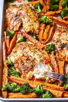 chicken, carrots and broccoli in a casserole dish with a fork