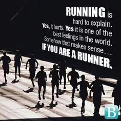 a group of people running down a street next to a sign that says running is hard to explain