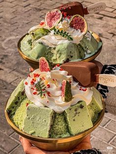 two bowls filled with different types of desserts on top of each other, one in the middle