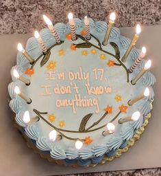 a birthday cake with lit candles on it