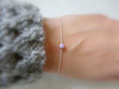 Opal bracelet / Blue Opal bracelet / ball bracelet / Sterling silver bracelet / Dot bracelet / Delicate bracelet / Simple bracelet Elegant, simple, Minimalist This dainty bracelet made with a tiny synthetic Opal bead and a delicate sterling silver chain. This bracelet is perfect for the woman who loves simplistic yet stunning fashion. Perfect for everyday wear and layering, this necklace will add a hint of elegance to any outfit. Bracelet features: - Synthetic Opal bead measures 4mm - Please cho Tiny Sterling Silver Minimalist Bracelet, Handmade Dainty Sterling Silver Bracelet, Opal Bracelet Silver, Bracelet Simple, Synthetic Opal, Ball Bracelet, Simple Bracelets, Bracelet Blue, Opal Bracelet