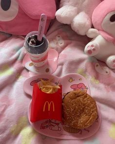 there is a plate with a sandwich and drink on it next to a teddy bear