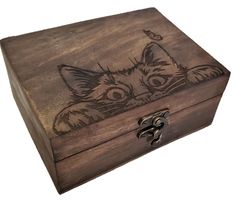 a wooden box with an image of a cat on it