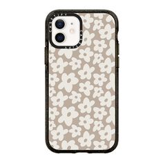 an iphone case with skulls and flowers on the front, in grey and white colors