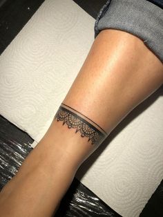 a woman's leg with a tattoo on it