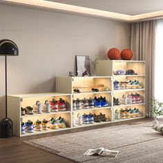 a living room filled with lots of shoes on shelves next to a lamp and window