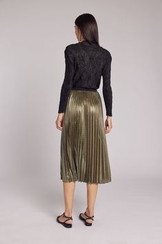 Prepare to captivate every eye in the room with our enchanting Esther Metallic Accordion Pleated Skirt – the ultimate statement piece for your most special occasions. As you move, the accordion pleats gracefully sway and glisten, leaving an indelible impression. Crafted from Luxe Metallic Lamé, this skirt ensures you're effortlessly chic and confident in the crowd. With a soft elastic waistband, you'll experience both secure and all-day comfort during your holiday and New Year celebrations. Midi Party Long Skirt With Accordion Pleats, Evening Midi Skirt For Fall, Elegant Stretch Pleated Tiered Skirt, Tiered Skirt For Party In Fall, Fall Party Tiered Skirt, Fitted Accordion Pleats Skirt For Party, Fall Party Skirt With Accordion Pleats, Party Tiered Skirt With Accordion Pleats, Elegant Bottoms With Accordion Pleats For Party