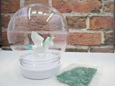 Make Your Own Glitter globe This listing is for One  DIY  Glitter Globe kit set. These fun DIY plastic globes make the perfect holiday project starter and keep your kids happy and busy . HOW TO ORDER -Choose unicorn -Choose Glitter color -Buy the listing This kit includes: (1) plastic globe (measures 4.25" x 4") (1) Unicorn (1) glitter pack Please note that  each unicorn  color may vary slightly than in photos. PLEASE NOTE: The water is OPTIONAL. If you choose to use water, you will need to use waterproof silicone adhesive ( not included) and  dry for 24 hours to fully cure. Adult supervision is highly advised. SHIPPING INFORMATION We ship via USPS. Please, be sure to select the appropriate shipment method if your order is urgent. All domestic shipments include tracking number NOTE: CHECK Glitter Water, Glitter Globes, Diy Unicorn, Water Globes, Unicorn Colors, Glitter Diy, Holiday Projects, Snow Globe, Fun Diys