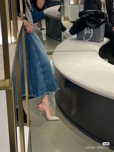 a woman sitting on top of a white counter