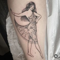 a woman's leg with a tattoo on it