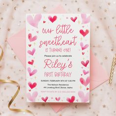 a pink and red heart birthday party card on top of a pink envelope with gold foil