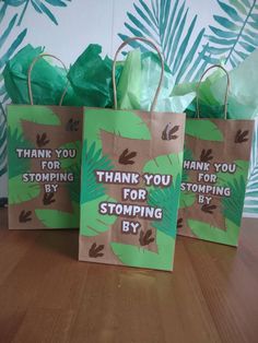 three bags with thank you for stomping by written on them sitting on a table