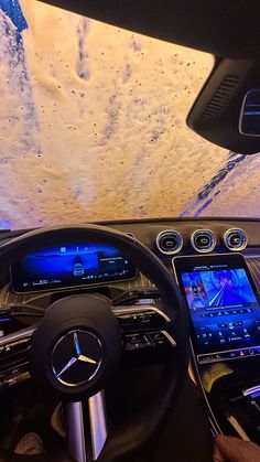 the interior of a mercedes vehicle with an image of snow on the ceiling and dashboard