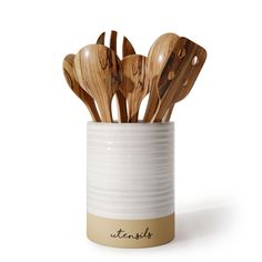 wooden utensils in a white ceramic container