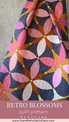 an image of a quilt with the words retro blossoms on it