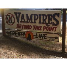 there is a sign that says vampire's beyond this point and treaty line