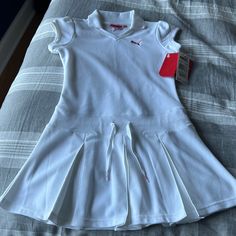 This Nwt Dress Is Super Cute For The Tennis Lover Or Anyone Who Loves The Look Of Tennis Dresses. Has Drawstring In The Waist And Small V Neck. Sleeves Have A Slight Puff And Shorter Than Regular Sleeves. Fitted White Tennis Dress With Short Sleeves, White Short Sleeve Tennis Dress, White Fitted Dress For Playwear, White Casual Dress For Playwear, Casual White Dress For Playwear, Casual White Tennis Dress For Spring, Polo Tennis Dress, Girls Tennis Dress, Tennis Dresses