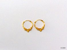 18kt gold hoop earring pair from rajasthan india. nice handmade design made of 18kt yellow gold, good for jewelry collection. Best gift item. Note - Please check pictures carefully for more details. Height - 2 cm Width - 1.65 cm Weight - 1.020 grams Material - 18kt yellow gold. Handmade Yellow Gold Round Huggie Earrings, Handmade 14k Yellow Gold Huggie Earrings, Traditional Hoop Huggie Earrings Gift, Hoop Temple Jewelry Earrings, Traditional Small Hoop Gold Plated Earrings, Traditional Small Hoop Huggie Earrings For Gifts, Traditional Small Huggie Earrings As A Gift, Traditional Small Hoop Earrings For Anniversary, Traditional Small Hoop Earrings For Anniversaries