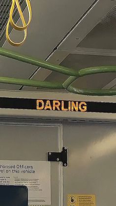 a sign that reads daring hanging from the ceiling