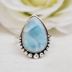 Dainty Blue Larimar Ring 925 Sterling Silver Ring Bohemian Unique Ring Weeding Gift For Women Dominican Larimar Ring Teardrop Gemstone Ring Gemstone:  Larimar   Stone Shape: Pear Gem Color: Blue  Metal: 925 Sterling Silver  Ring Sizes: All Size Rings Available ------------------------------------------------------------------------------------------------------------------------------------------------------------------ Larimer :- BENEFITS OF GEMSTONES :- It stimulates the heart, throat, third eye and crown chakras facilitating inner wisdom and outer manifestation. It represents peace and clarity, radiating healing and love energy. Meaning Of Gemstone :- Larimar is said to enlighten and heal in a physical, emotional, mental and spiritual way ------------------------------------------------ Teardrop 925 Stamped Rings For Anniversary, Teardrop Shaped Anniversary Rings Stamped 925, Anniversary Teardrop Ring Stamped 925, Blue Sterling Silver Teardrop Ring, Sterling Silver Teardrop Blue Ring, Blue Teardrop Sterling Silver Ring, Wedding Larimar Gemstone Rings, Bohemian Teardrop Rings For Anniversary, Bohemian Teardrop Anniversary Rings