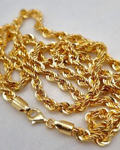 --- Crafted in GUARANTEED HIGH-QUALITY 18-Karat GOLD -- Pure Gold Material, Not Gold-Filled or Plated --- ** Chain options base on their lengths, thickness and weights: 16 inches - 4 millimeters: 6.70 grams 18" - 4 mm : 7.55 gr  20" - 4 mm : 8.39 gr 22" - 4 mm : 9.21 gr 24" - 4 mm : 10.07 gr 26.5" - 4 mm : 11.00 gr Closure: Lobster Claw ( Strong and Durable ) Chain style: Rope Chain, Diamond-cut, 18K Gold Please feel free to message me for any custom sizing! *About 18K Gold: 18K gold pieces are crafted to last a lifetime. When it comes to quality and luxury, 18K gold jewelry stands at the top. It's resistant to rubbing off, flaking, and tarnishing, ensuring that your investment maintains its brilliance over time. Plus, real gold only becomes more valuable with age, making it not just a pur Chain Diamond, Chain For Men, Gold Rope Chains, Rope Chain Necklace, Gold Chains For Men, 18k Gold Jewelry, Precious Jewels, Women Birthday, Gold Piece