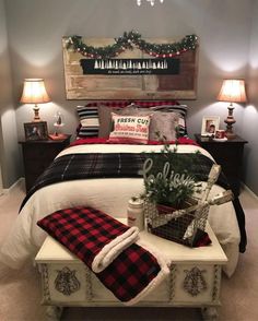 a bedroom decorated for christmas with red and black decor