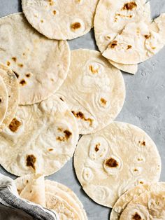 tortillas on a baking sheet ready to be cooked and put in the oven