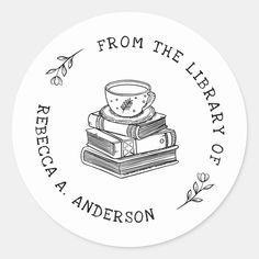 a round sticker with the words from the library of alexandria anderson on it and stacked books