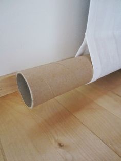 a roll of toilet paper is laying on the floor