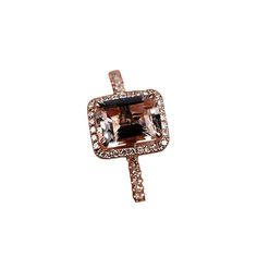 an orange and white diamond ring with diamonds on it's shants, set in 18k rose gold