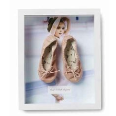 a photo frame with a ballerina's shoes on it