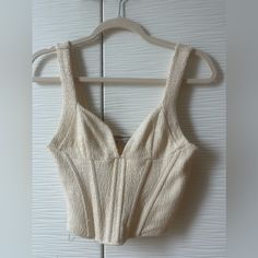 Unworn With Tags , In Excellent Condition. Europe Size Medium, Fits Like A Us Small. Chic White Corset With Built-in Bra, Fitted White Crop Top With Boned Bodice, White Crop Top Corset For Summer, White Cropped Crop Top With Boned Bodice, White Crop Top With Boned Bodice For Party, White Boned Bodice Crop Top For Party, White Sleeveless Crop Top With Boned Bodice, Elegant White Crop Top With Boned Bodice, Summer Beige Corset With Built-in Bra