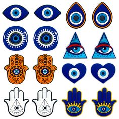 an assortment of blue and orange evil eye stickers on a white background with the third one in front of them