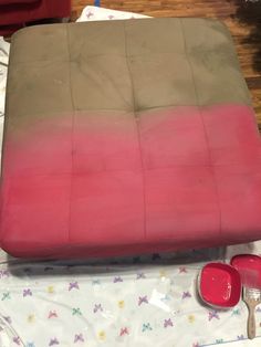 a futon mattress sitting on top of a bed covered in pink and green sheets