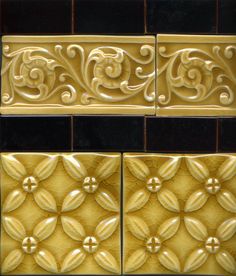 three different types of decorative tiles in gold, black and brown colors with swirl designs