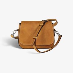 "Stay hands-free and stylish with our women's crossbody bag. Find the perfect accessory to complete any look, whether you're dressed up or down. Carry your essentials in style with a timeless accessory that will never go out of fashion. ✦ Italian Leather: Full-grain vegetable tanned ✦ Fabric interior with leather accents ✦ Magnetic closure ✦ Internal zippered compartment ✦ Polished nickel hardware  ✦ Leather Strap: Adjustable drop (19.5\" - 25.5\") ✦ Strap width: 0.75\" ✦ Weighs 1 lb 4 oz ✦ Dime Minimalist Satchel Shoulder Bag With Detachable Strap, Minimalist Shoulder Bag With Detachable Strap And Satchel Shape, Minimalist Satchel With Detachable Strap, Modern Satchel Saddle Bag With Adjustable Handle, Modern Saddle Bag With Adjustable Handle, Minimalist Crossbody Satchel With Detachable Strap, Minimalist Satchel With Detachable Strap For On-the-go, Trendy Everyday Saddle Bag With Adjustable Handle, Everyday Leather Flap Bag With Adjustable Handle