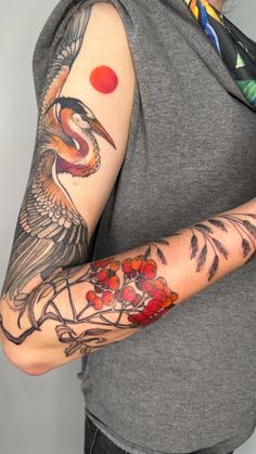 a woman with a bird tattoo on her arm