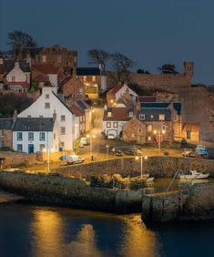 a small town by the water at night